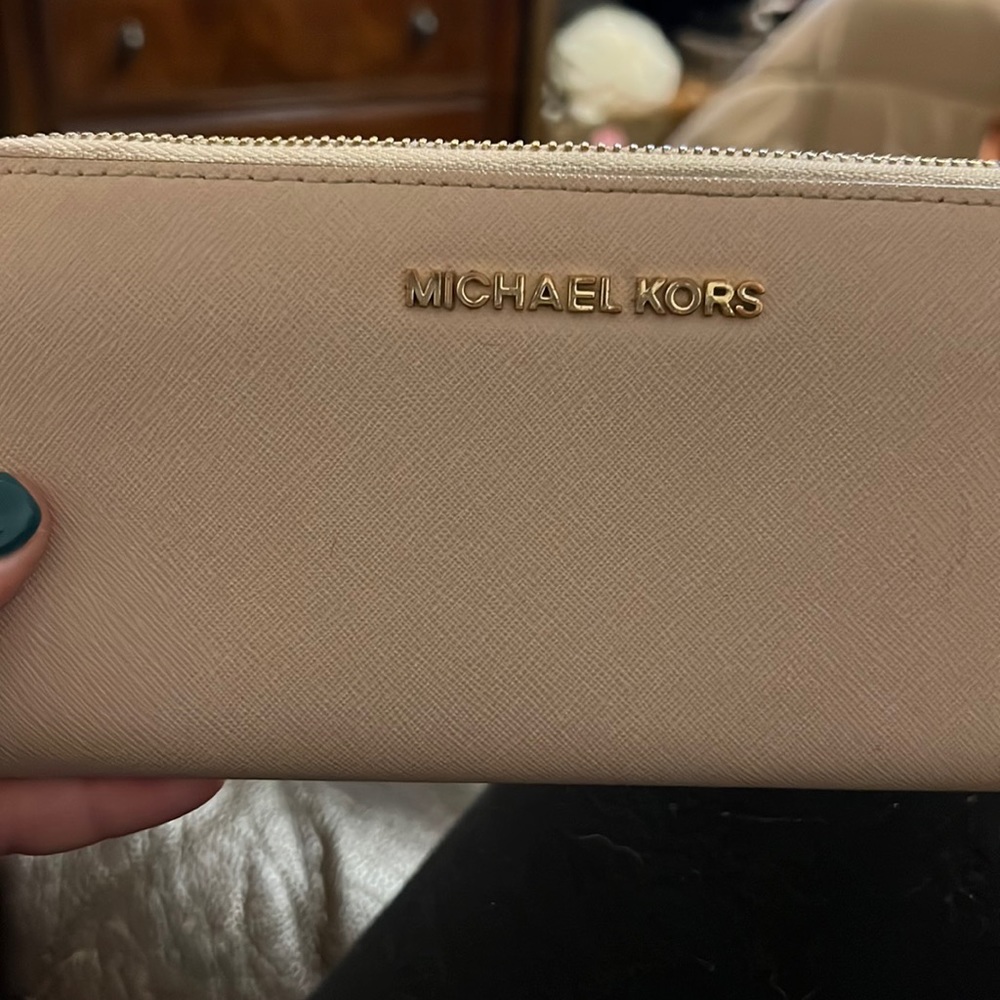 Michael Kors dusty rose zip around wallet.